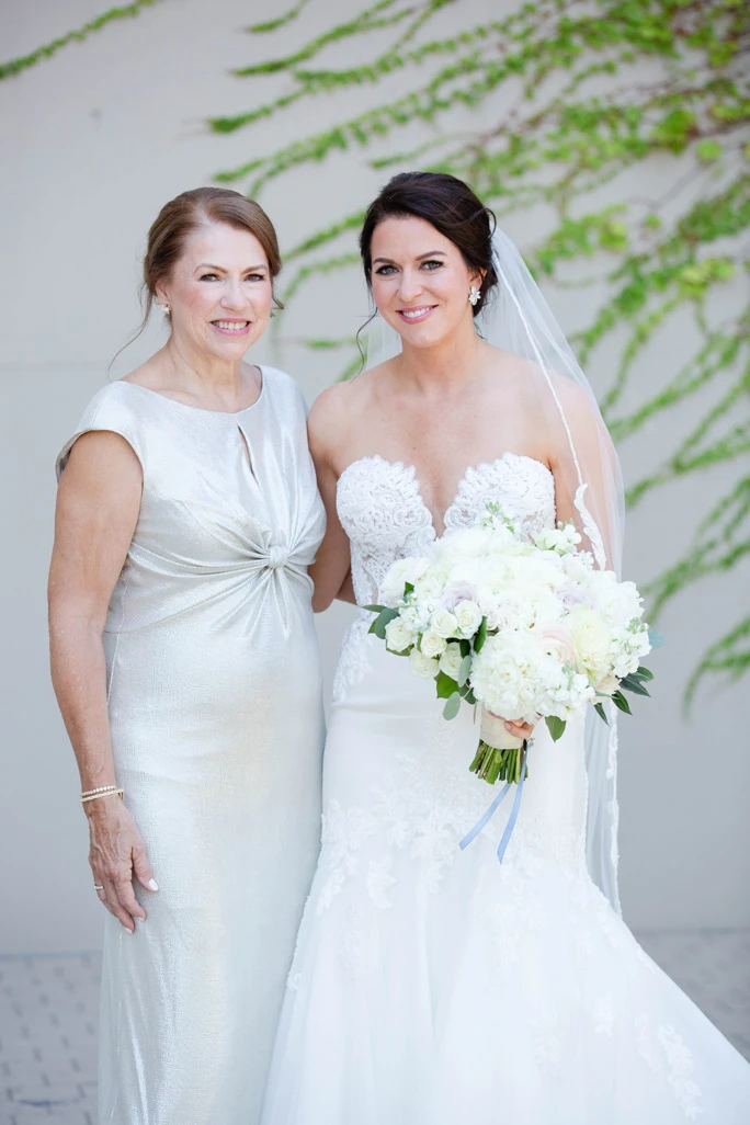 True Bride Bonnie wearing a Martina Liana wedding dress, style 906, posing with her Mom.