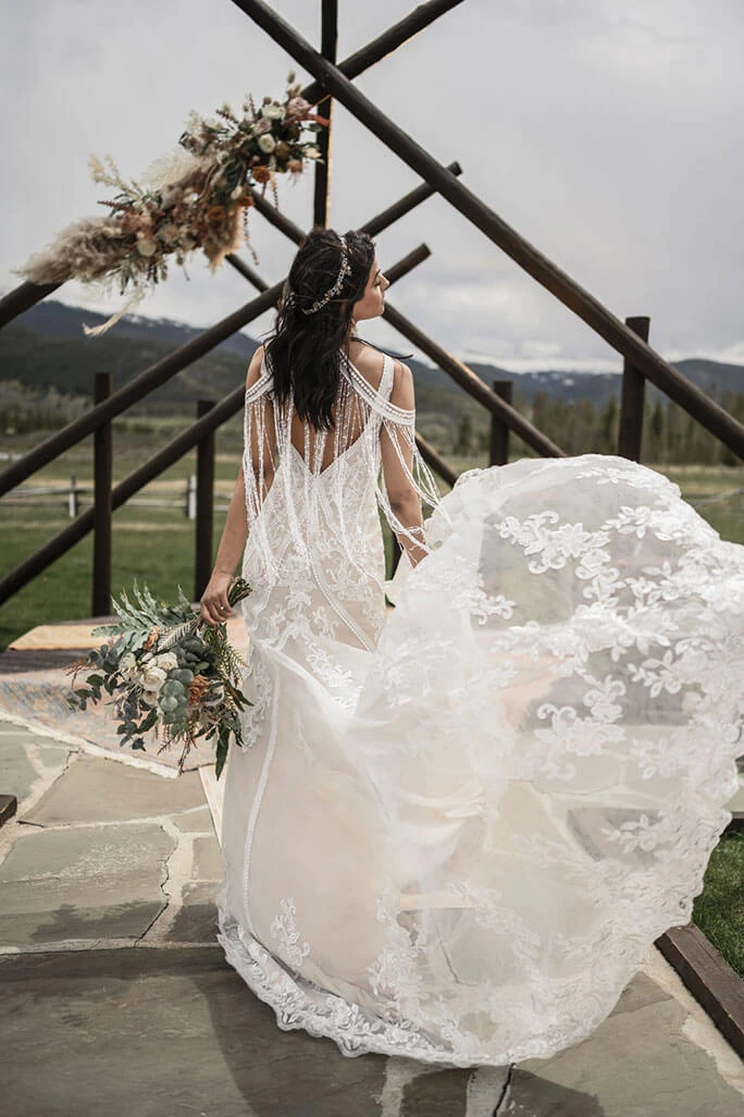 Bride wearing a crown paired with her All Who Wander gown, style Avery