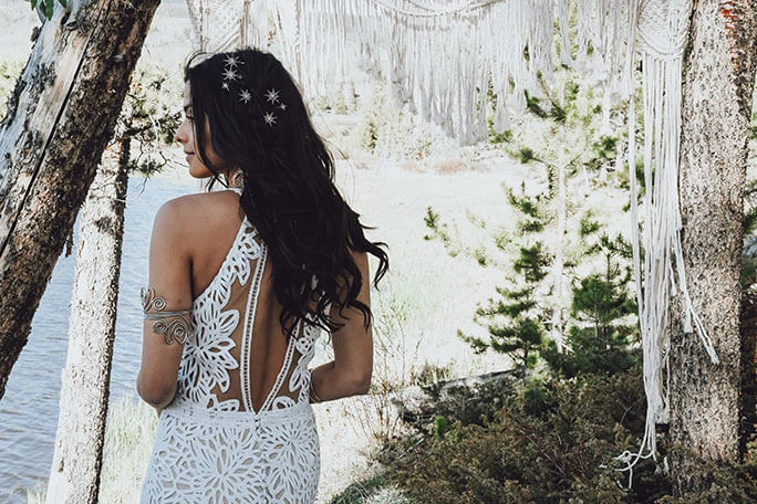 Bride wearing her Adley gown, from the All Who Wander wedding dress collection, paired with hairpins.