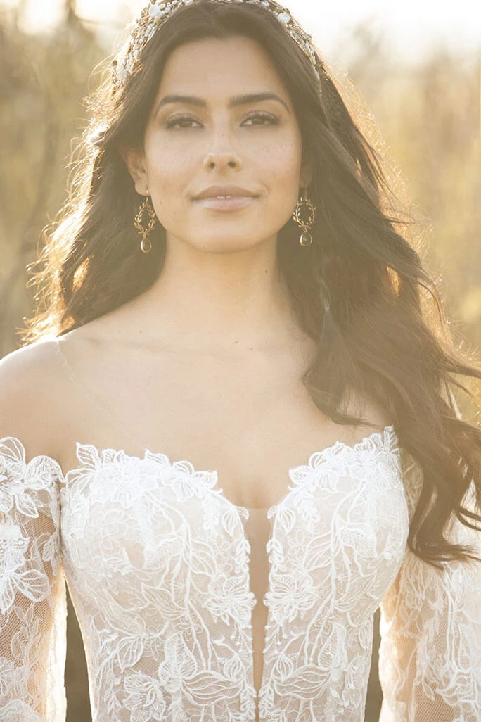 Bride wearing style Finn from bridal gown designer All Who Wander. She paired her wedding dress with a bridal headband.