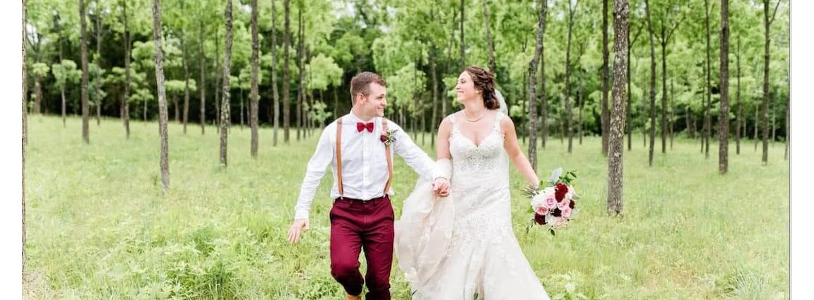 Real Belle Vogue Bride, Caitlin running through a forest in her wedding dress with her husband in Kansas City.