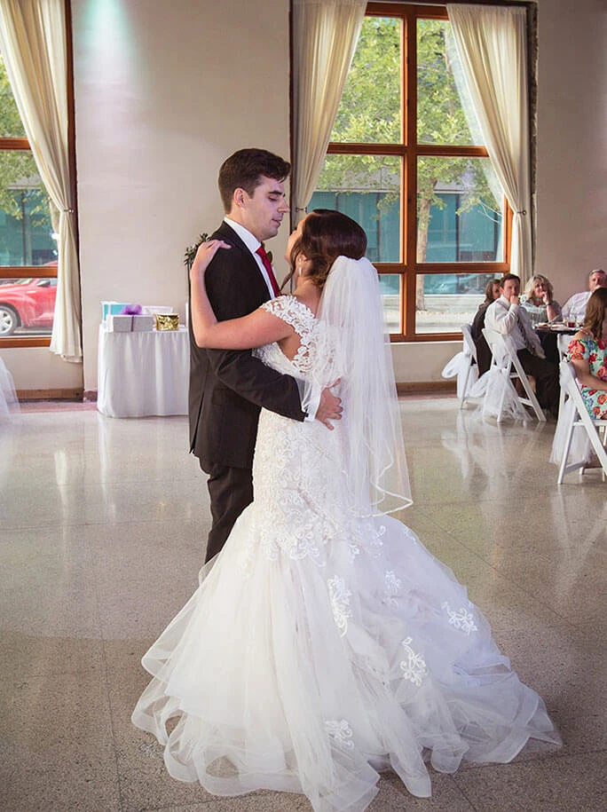 True Bride Kerry on the dance floor with her husband with her wedding dress bustled