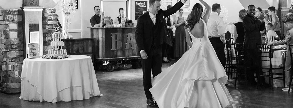 True Bride, Kelsey dancing on the dance floor with her husband, wearing her Stella York wedding dress, style 6758