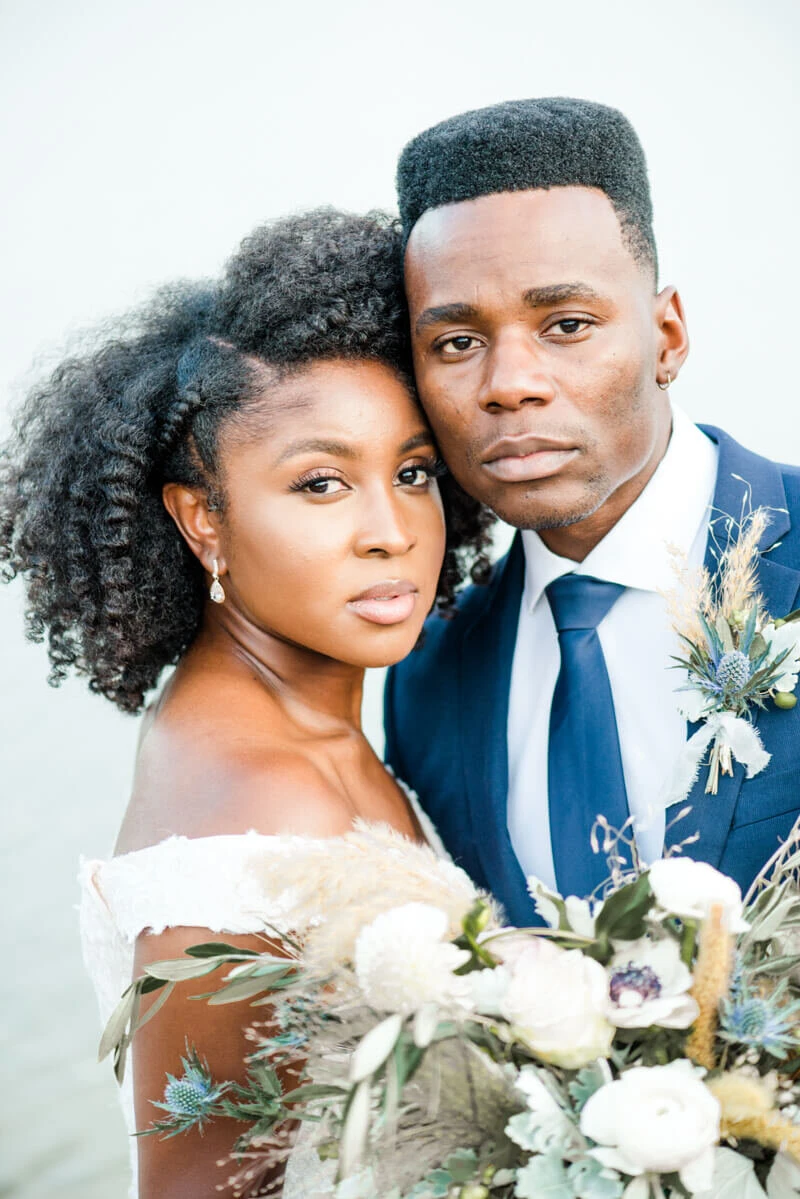 Trendy bride styled photo featuring groom and bride wearing essense of australia dress in style Style D2815