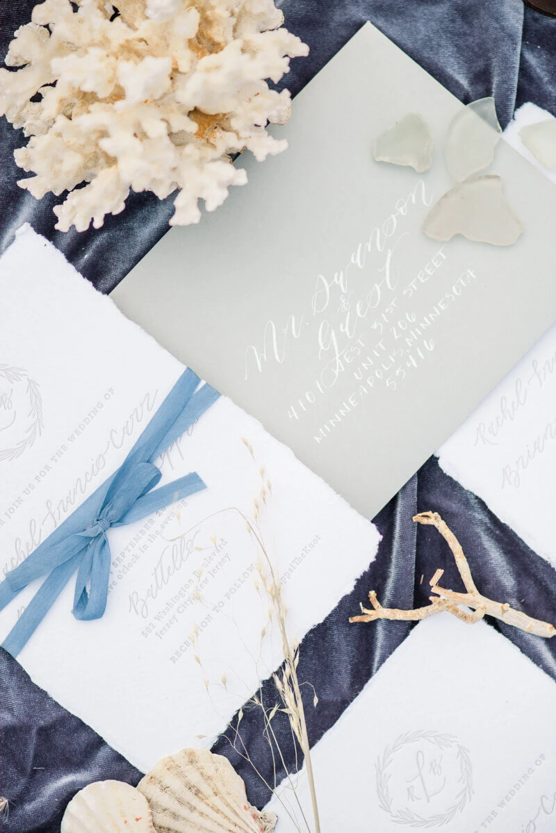 Trendy bride styled photo of wedding invitations