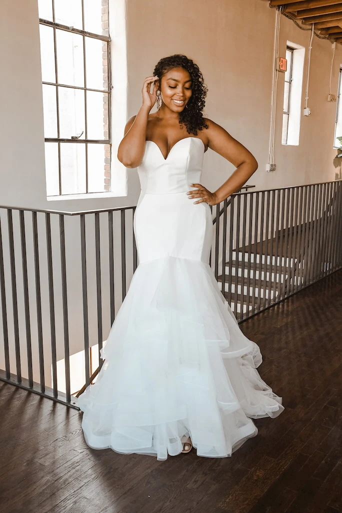 Model wearing wedding dress Essense of Australia D2027
