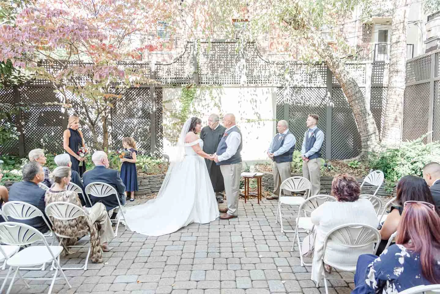 bride and groom hosting a virtual wedding ceremony