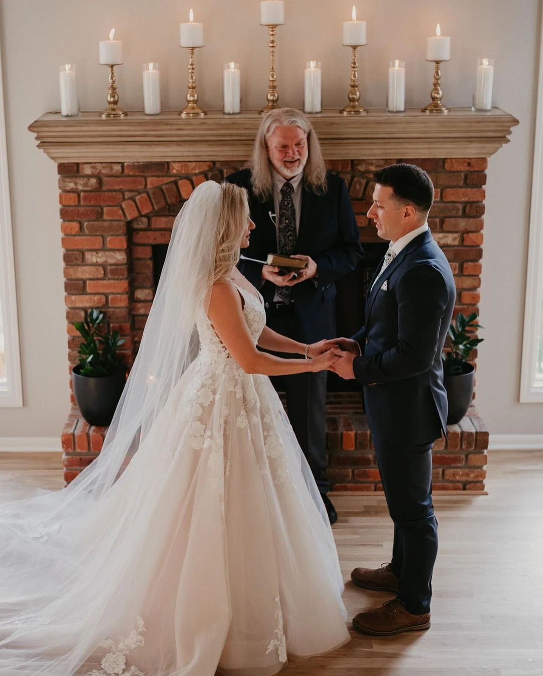 bride and groom at ceremony exchanging vows