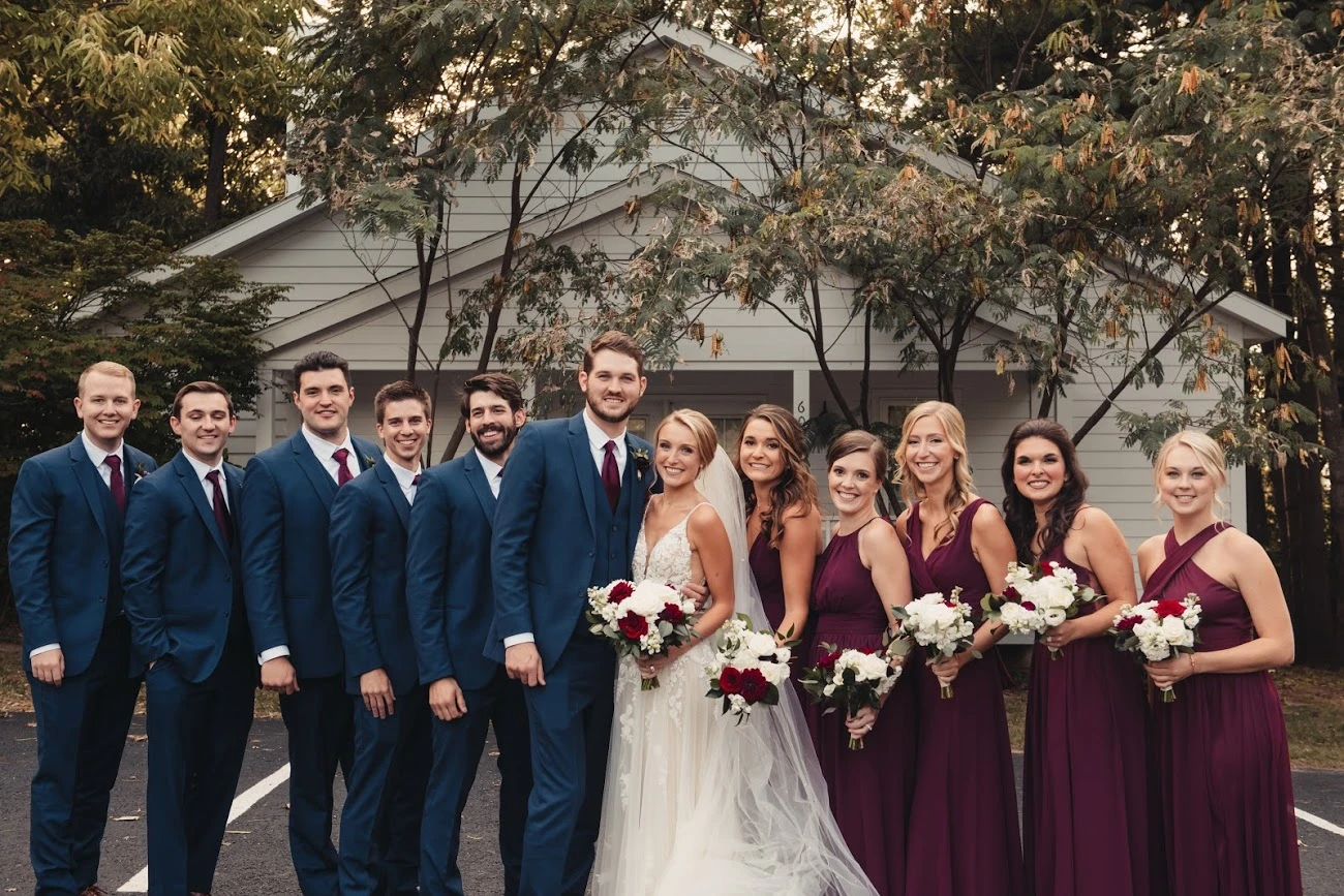 martina liana true bride posing for photo with bridesmaid and groosmen