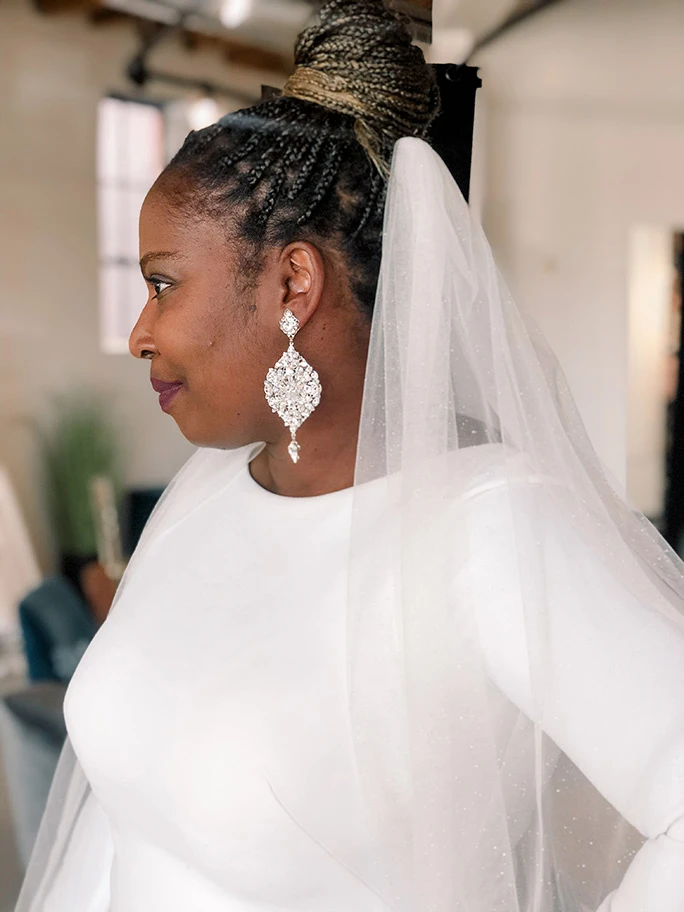 Side view of a bride wearing a Martina Liana wedding dress, style 1157 + 2050ST veil 