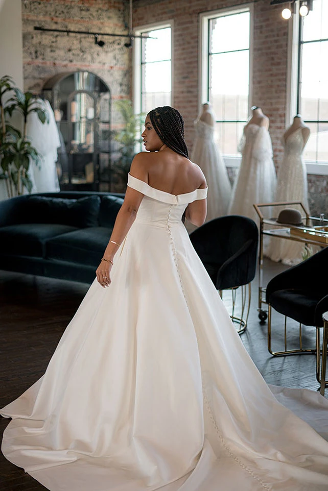 Bria Jones wearing off the shoulder wedding gown - style 1266 by Martina Liana