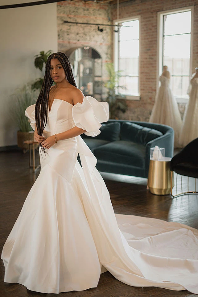 Bria Jones wearing mordern ballgown with puffed sleeves - style 1266 by martina liana