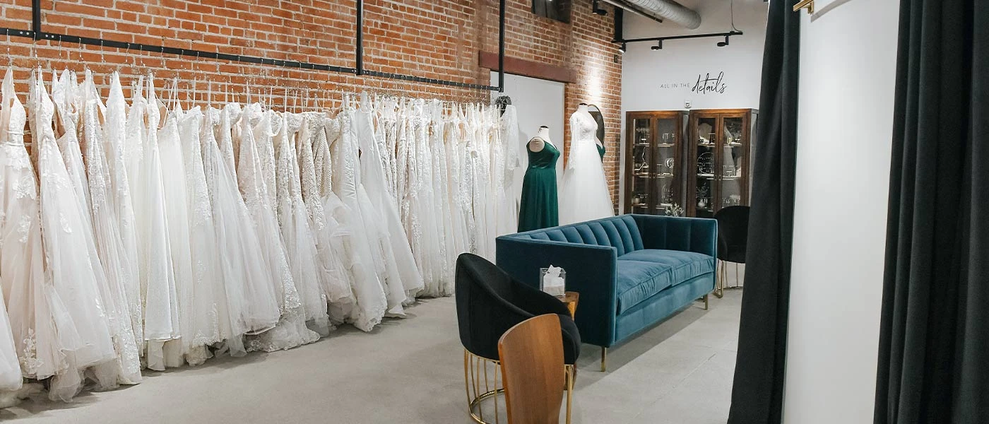 Rack of stunning wedding dresses at our True Society by Belle Vogue Bridal shop in Kanas City, Missouri.