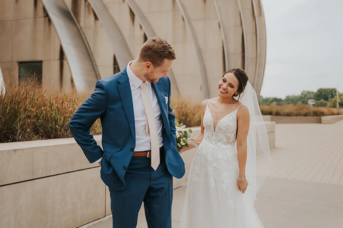 bride and groom at kauffman center in kansas city - style D2840 by essense of australia