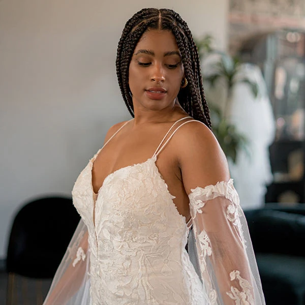 True Bride Bria trying on a dress at True Society by Belle Vogue Bridal Crossroads