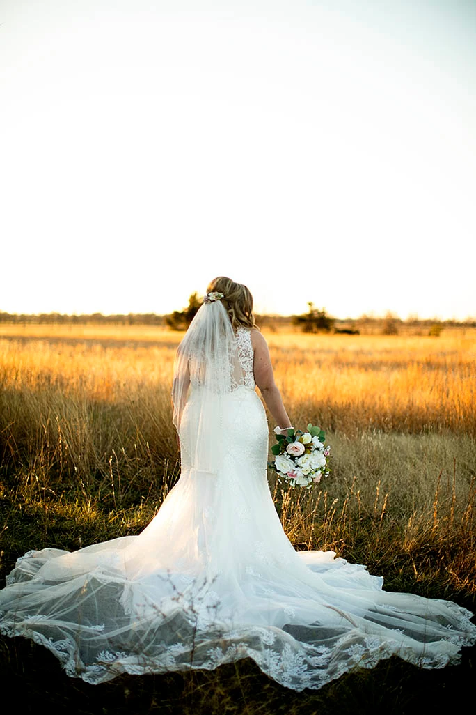 real bride holding flower bouquet - style D2174 by essense of Austral