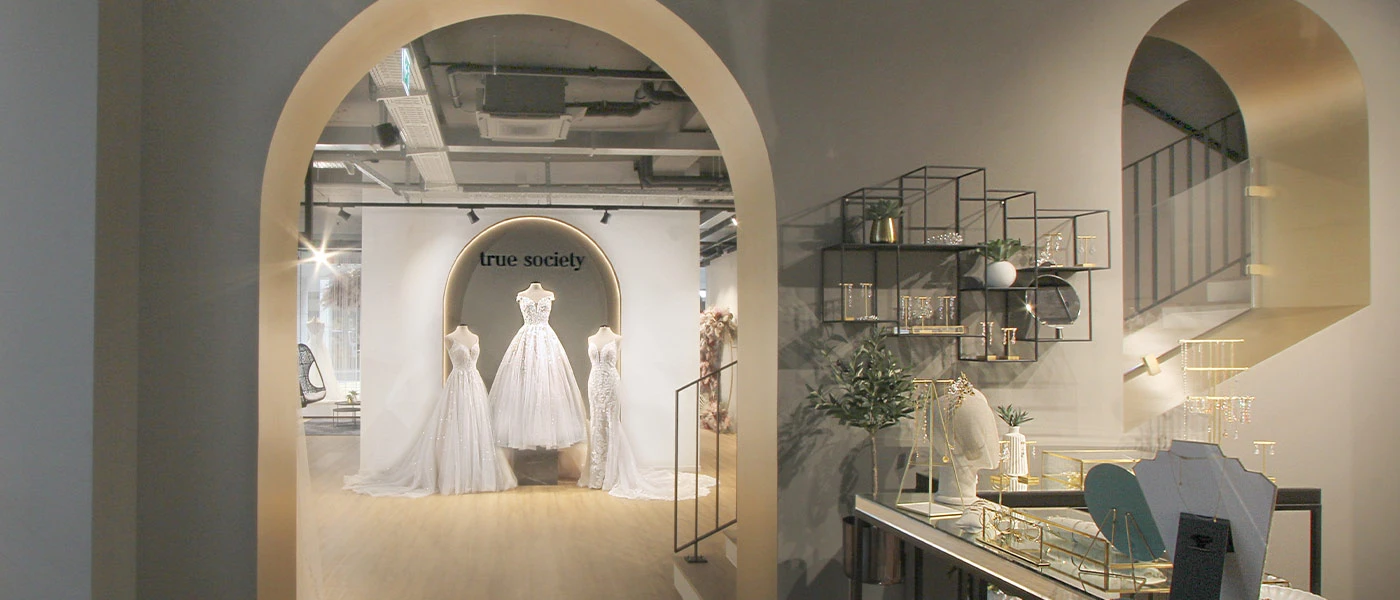 Entry wall with wedding dresses view at our gorgeous True Society bridal shop located in Zug, Switzerland