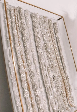 Wide selection of beaded, jeweled and lace wedding dress belts.
