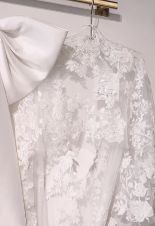 Lace bridal jacket to wear over a wedding dress.