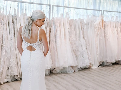 back view of bride wearing a lace wedding gown - stella york 6834