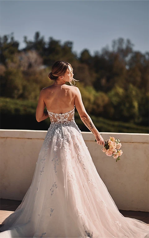 Bride wearing princess style strapless lace and tulle wedding gown