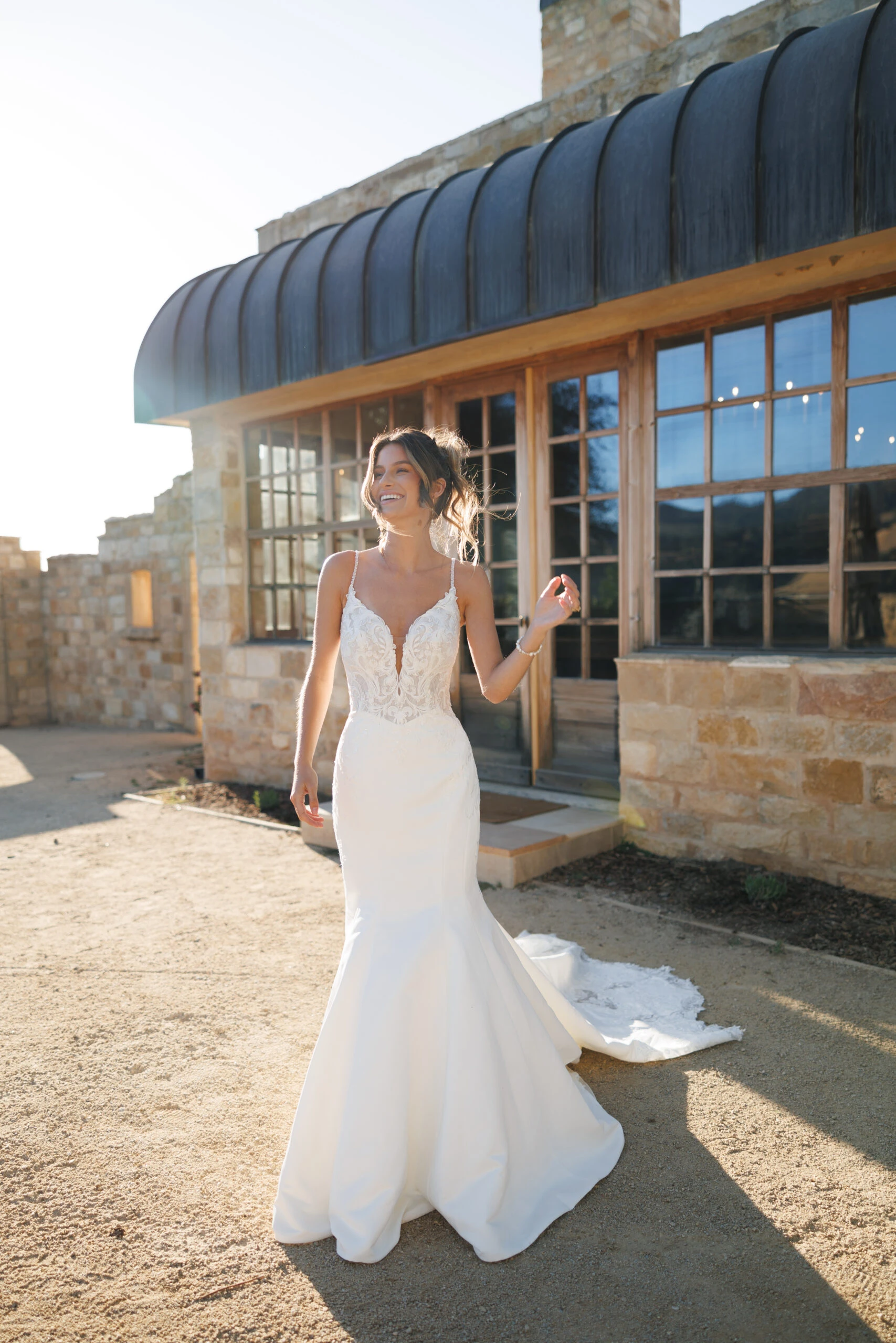 Bride in a spaghetti strap wedding dress