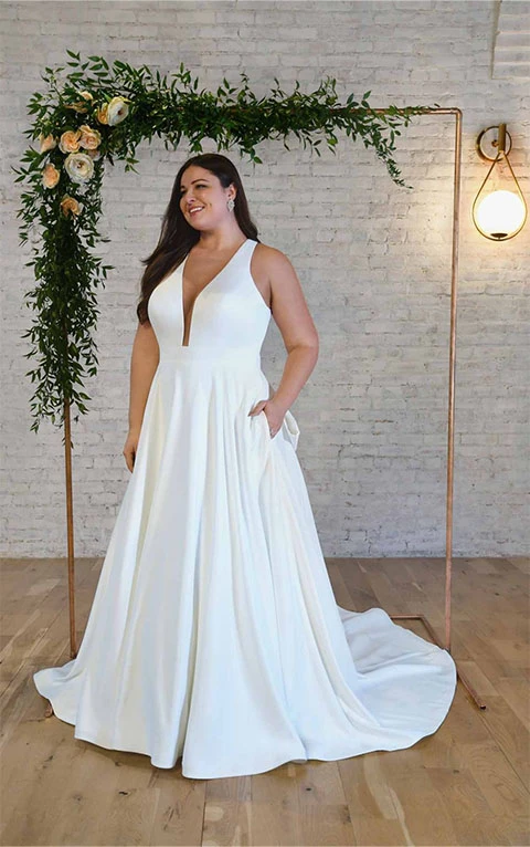 Plus size bride wearing beach inspired simple a line wedding dress