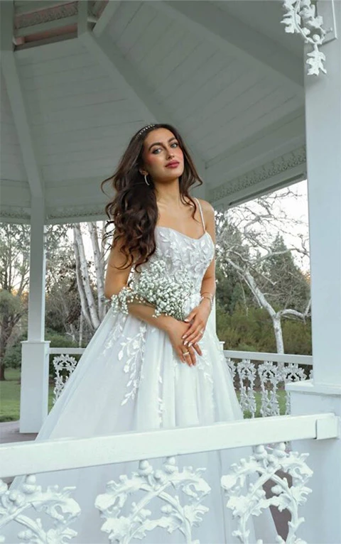 Bride wearing princess style lace and tulle wedding gown