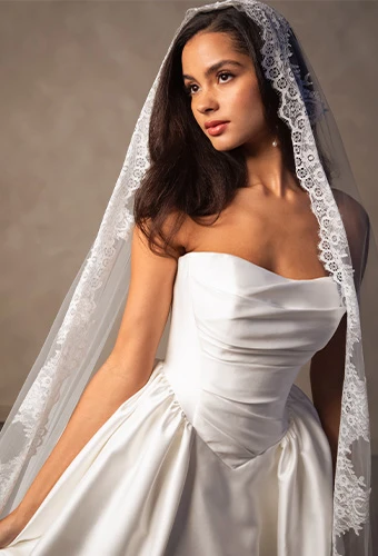 Bride wearing simple strapless ballgown wedding dress