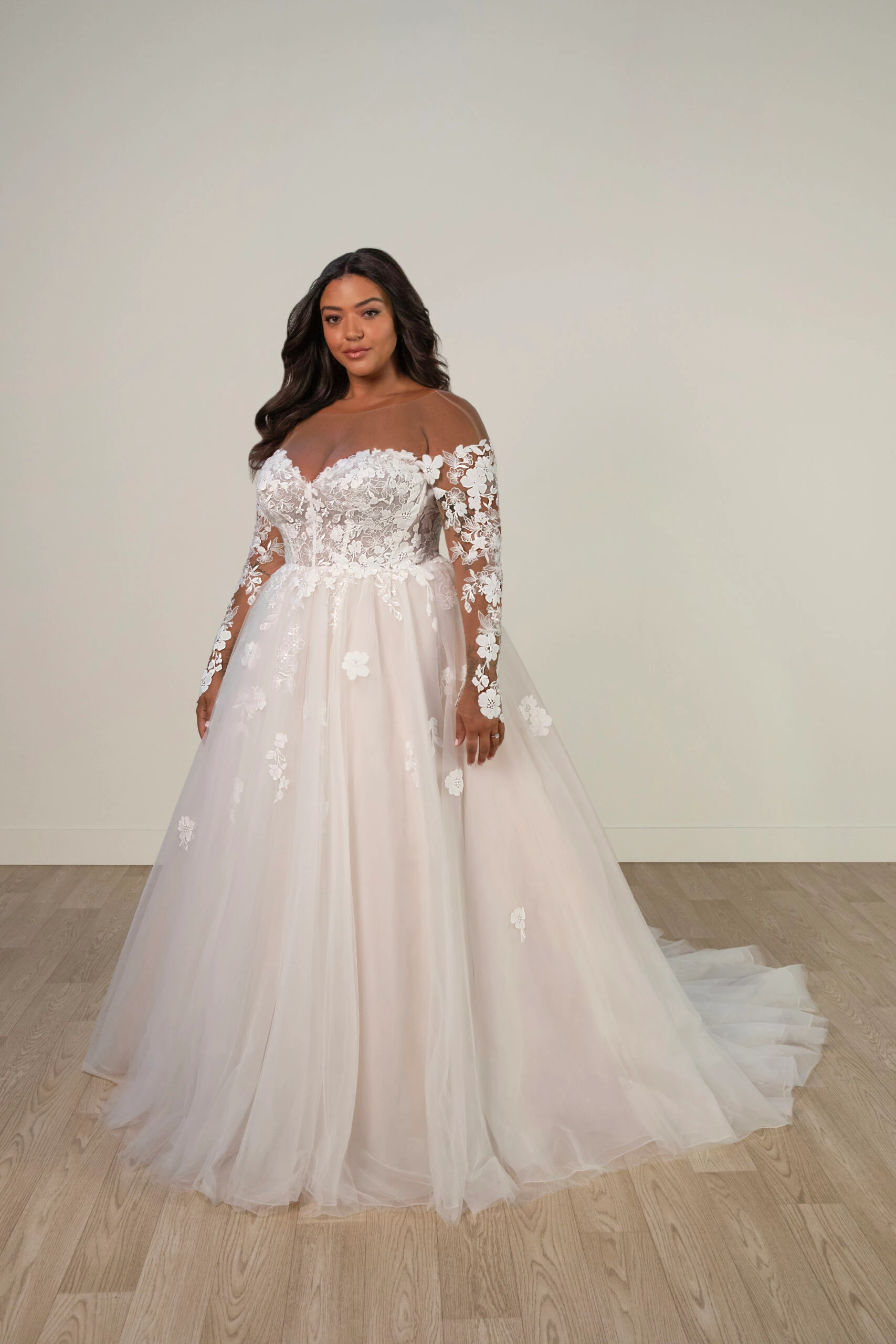 Bride wearing an off-the-shoulder long sleeve lace wedding dress