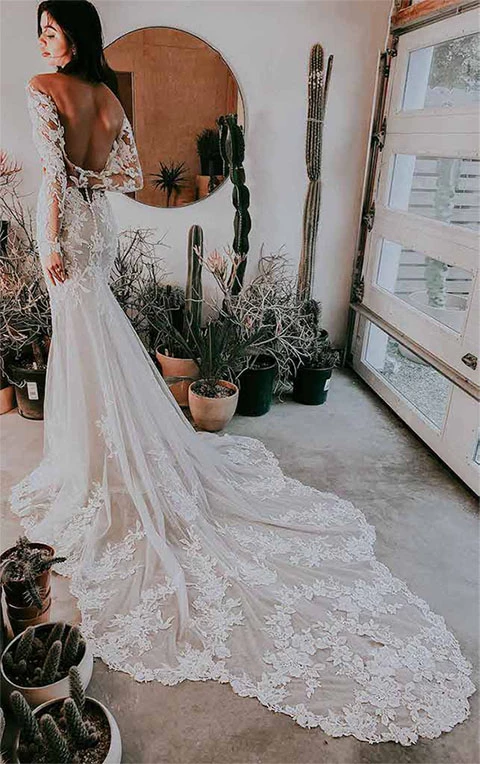 lace wedding dress with cathedral train and low back