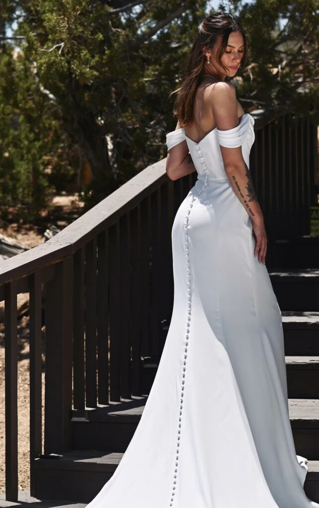sleek sheath wedding dress with off the shoulder sleeves and button back - 1566 by Martina Liana