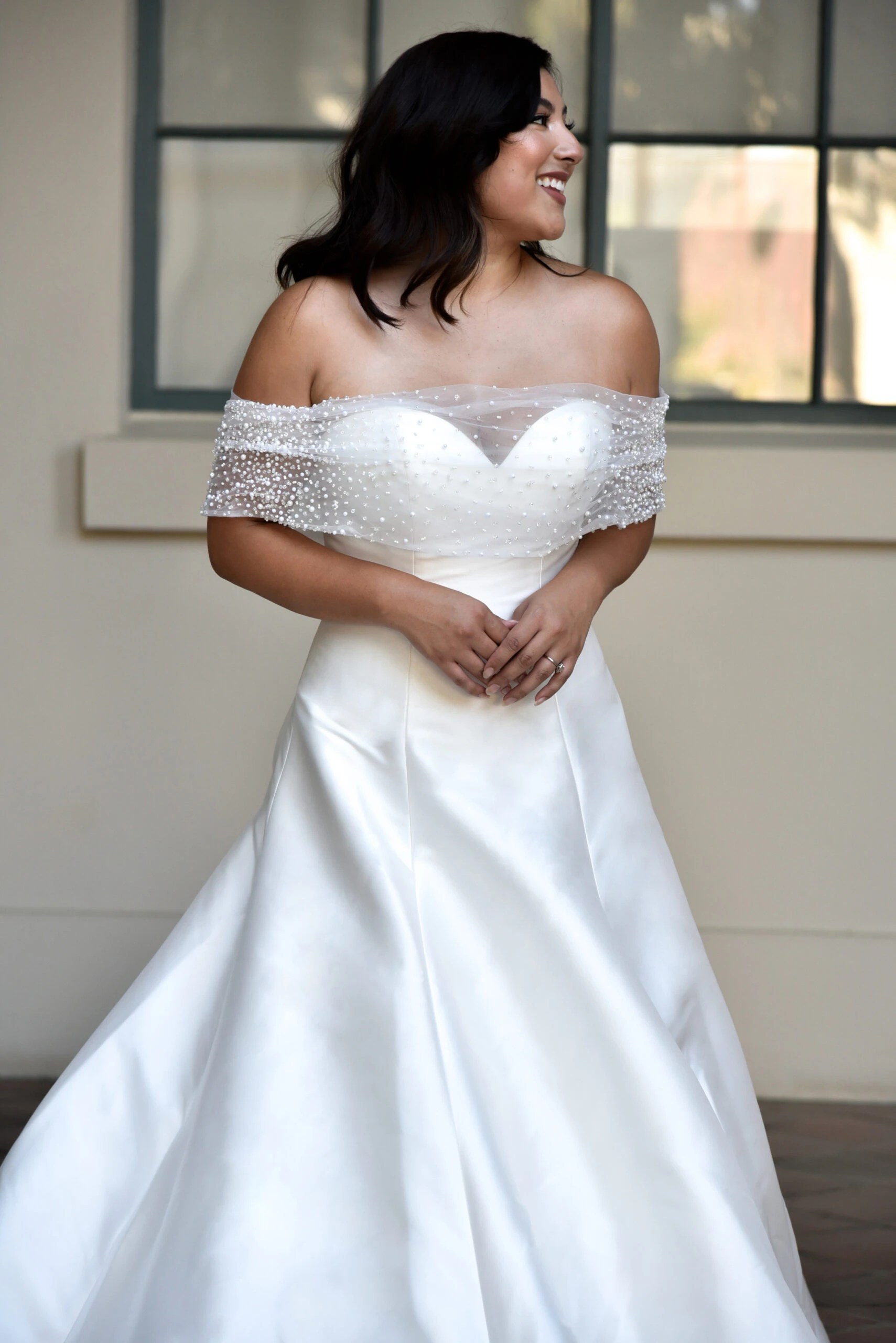 What can I do to conceal bottom of corset line in wedding gown