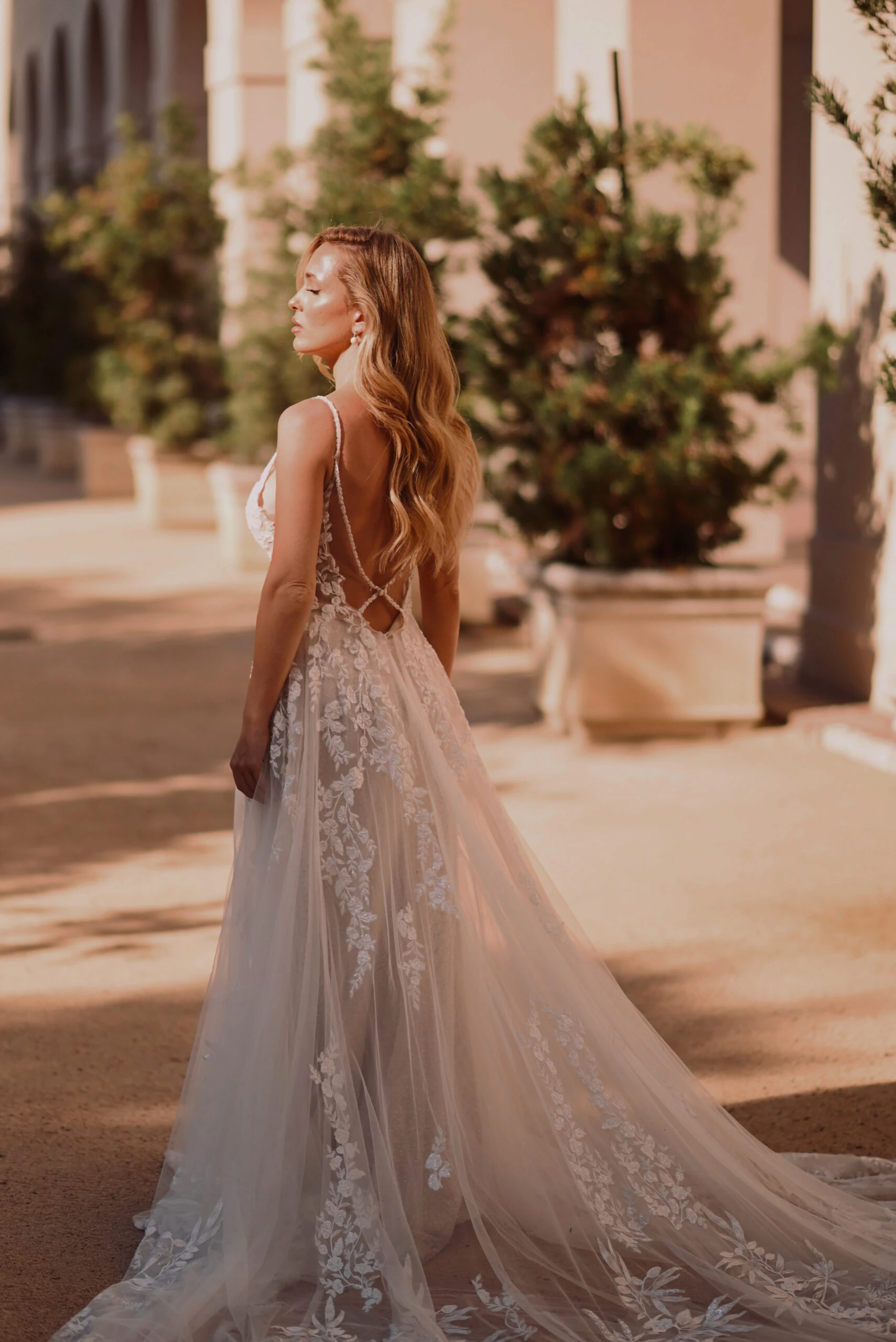 back of Bride wearing a lace a-line wedding dress