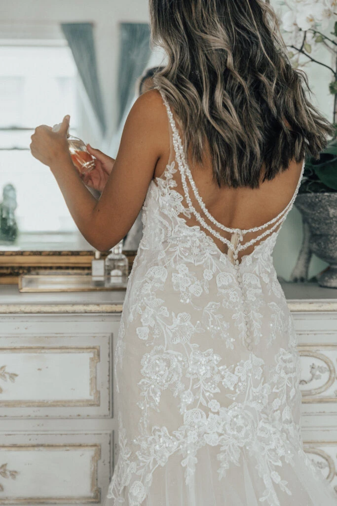 Bride showing the back of sparkly lace mermaid gown