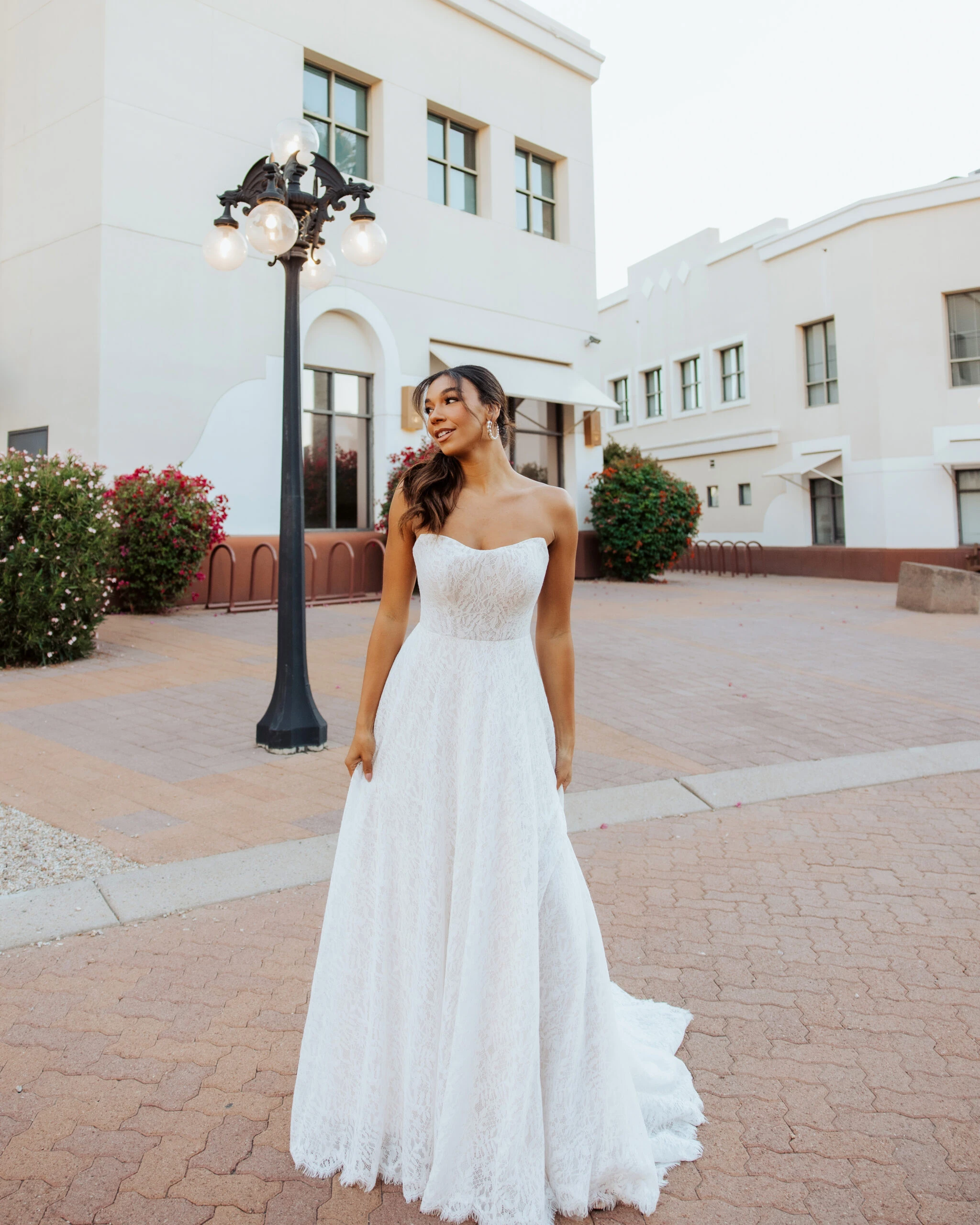 A Bride wearing a strapless sweetheart neckline wedding dress