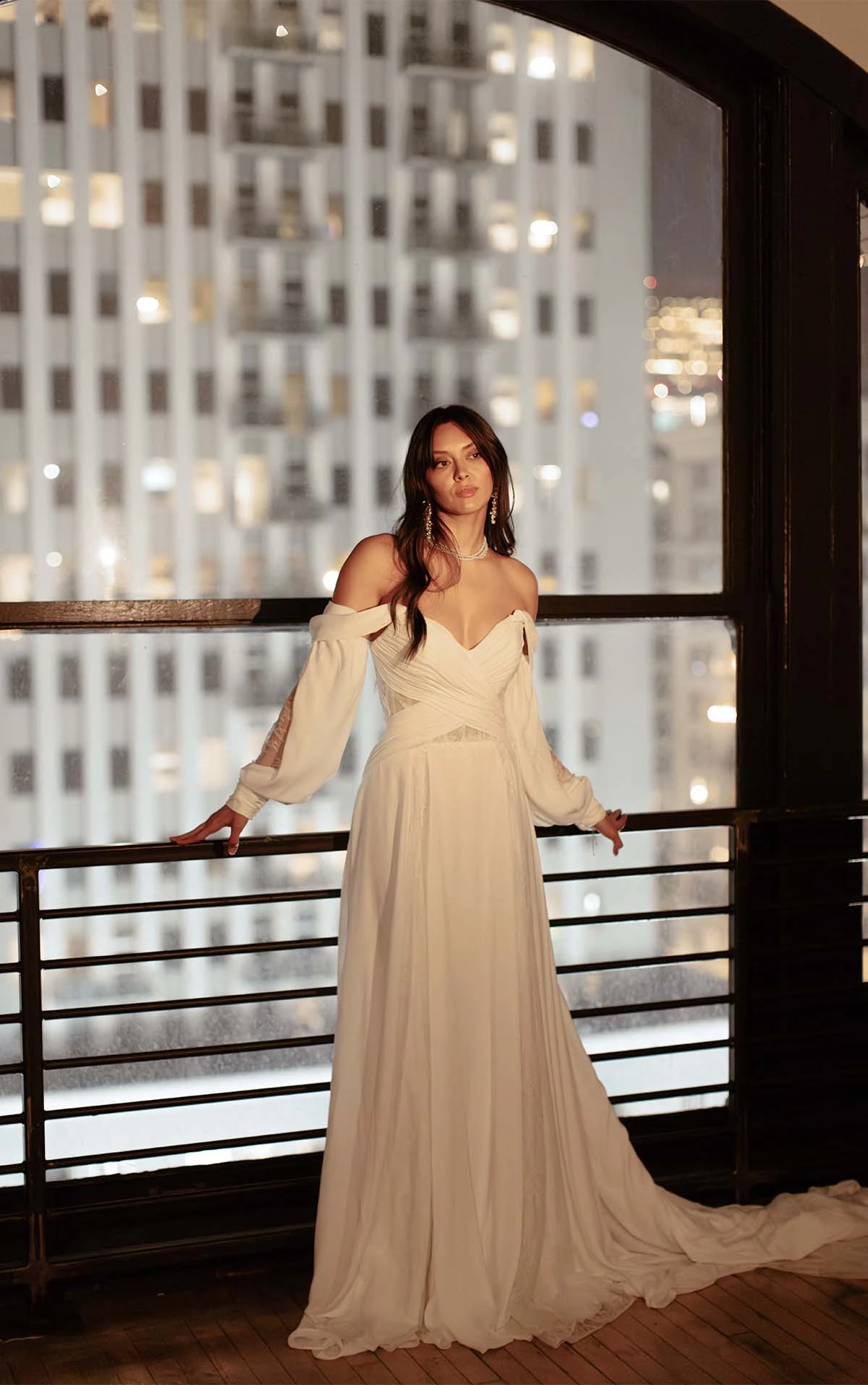 boho long sleeve wedding dress with lace cutouts and flowy train - dune by all who wander