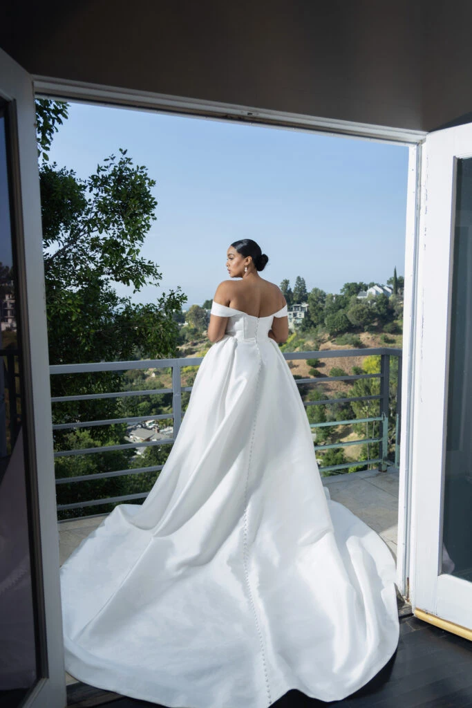 Back of Bride wearing a plus size strapless/off the shoulder wedding dress