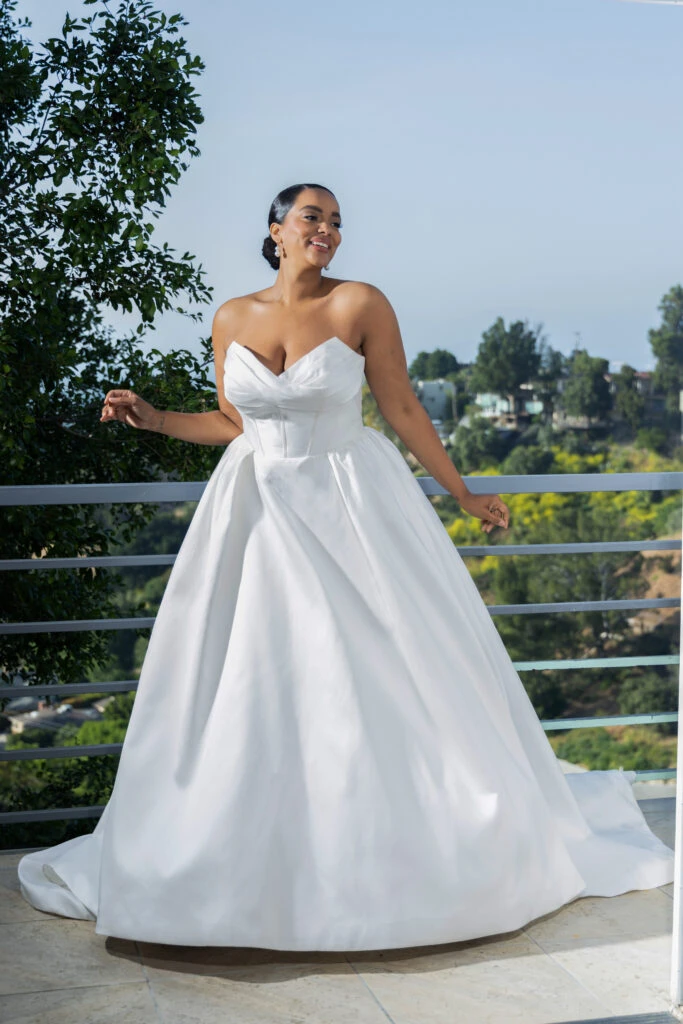 Bride wearing a plus size strapless/off the shoulder wedding dress
