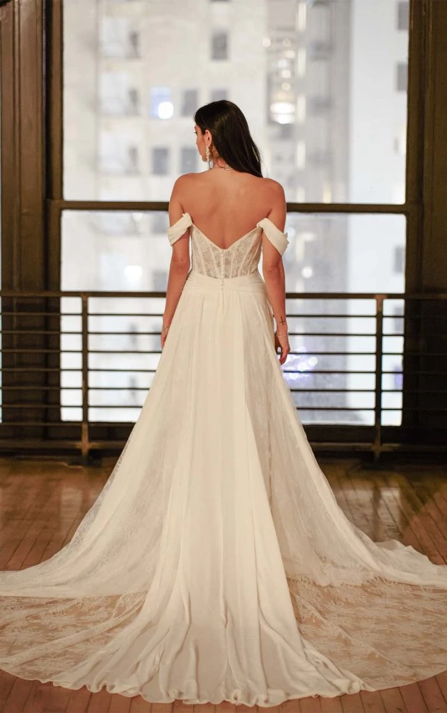 flowy boho wedding dress with off the shoulder sleeves and lace train - dune by all who wander