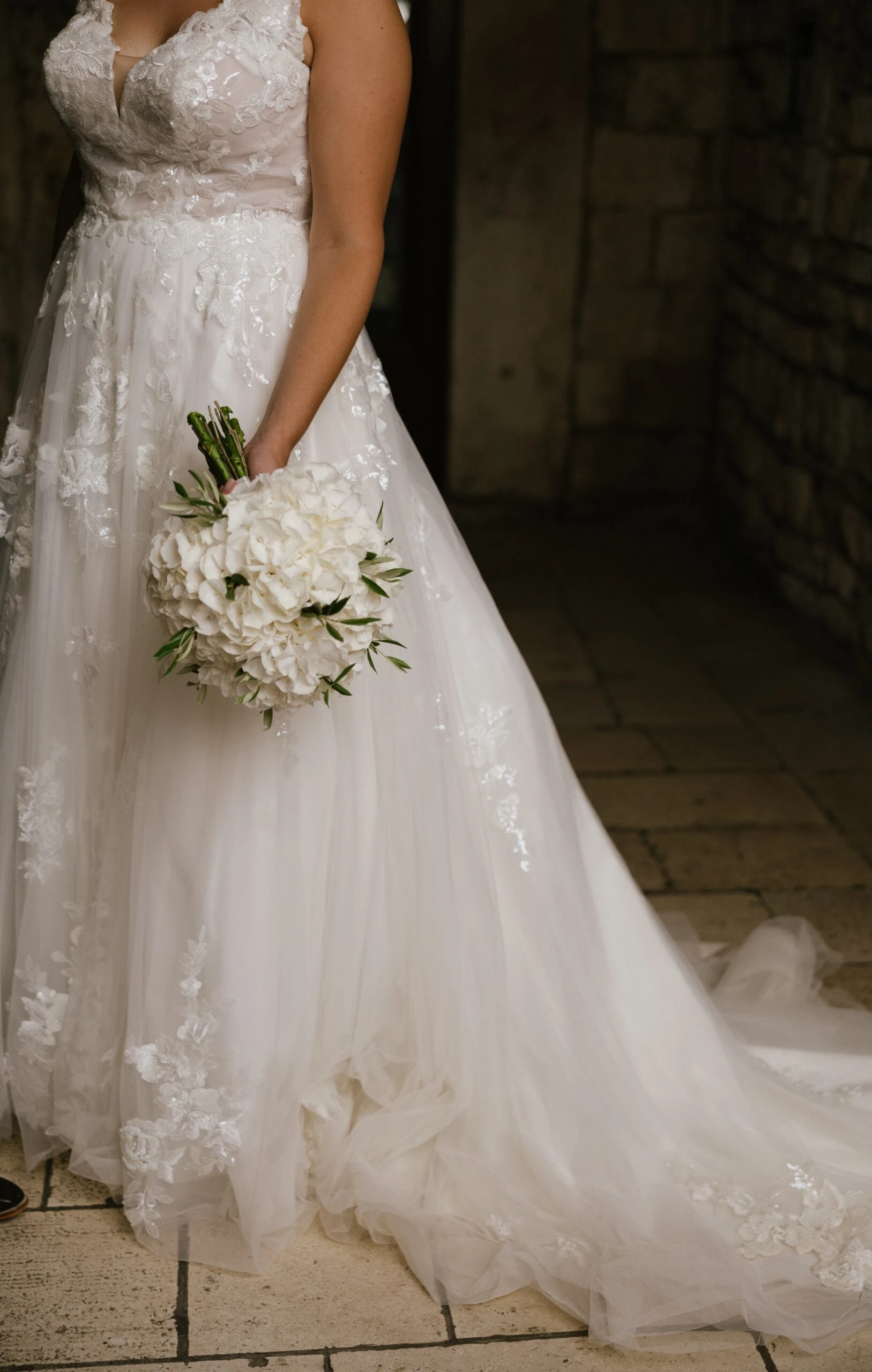 Bride holding flowers wearing a wedding dress