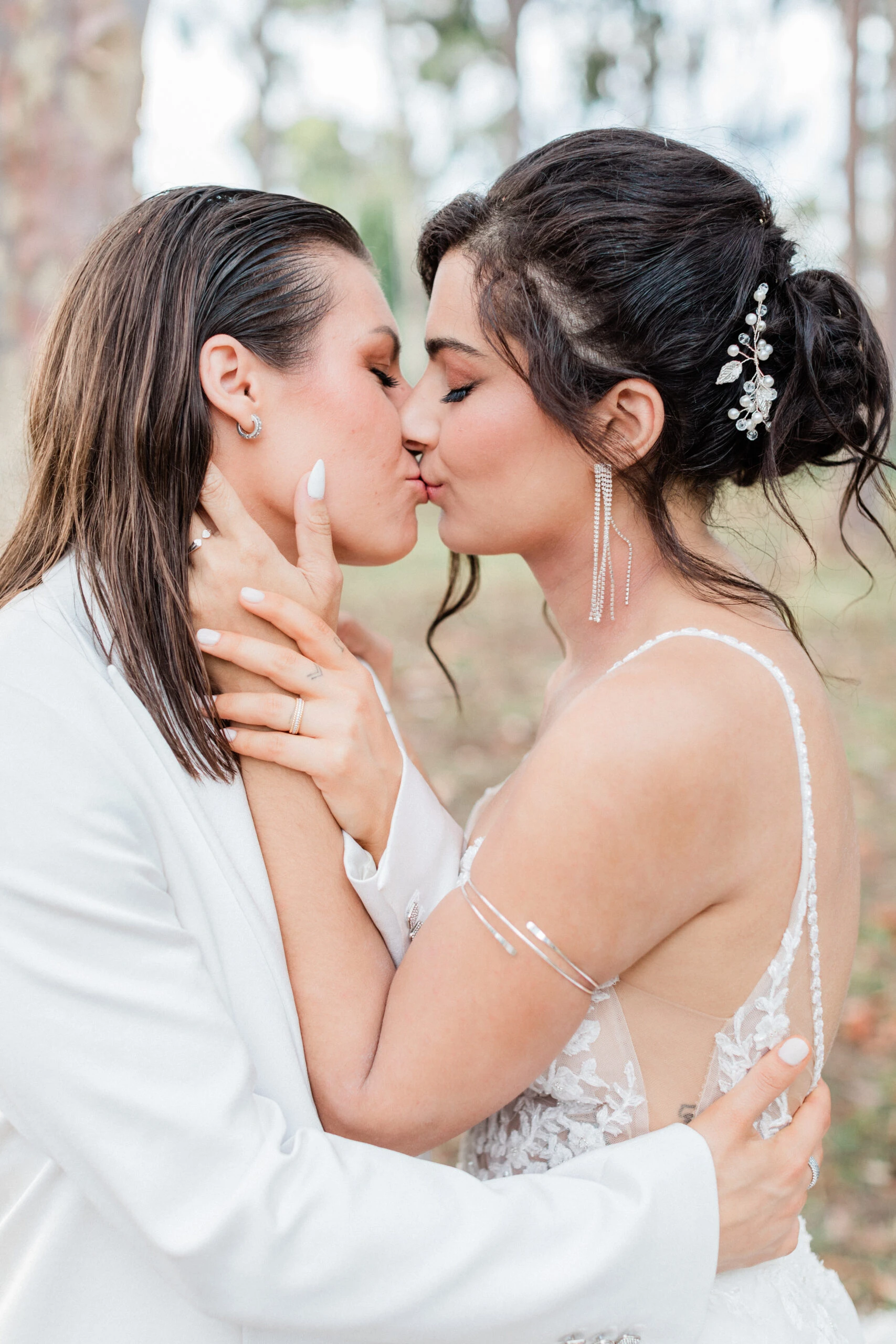 true brides ramona and charlotte kissing on wedding day - Martina Liana 1137