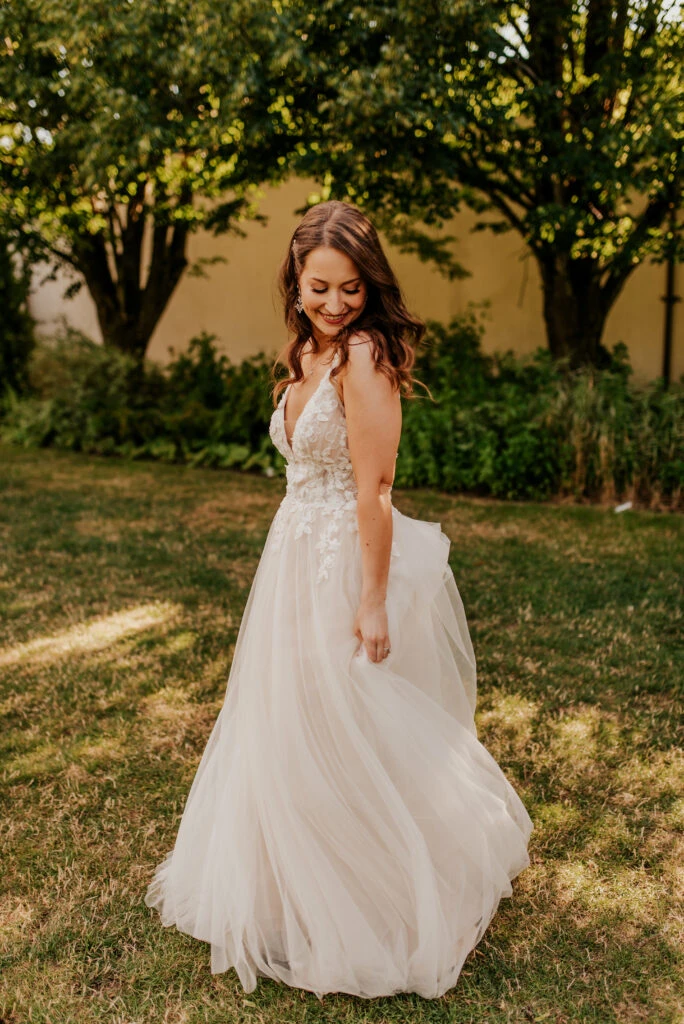Bride wearing an a-line floral wedding dress

