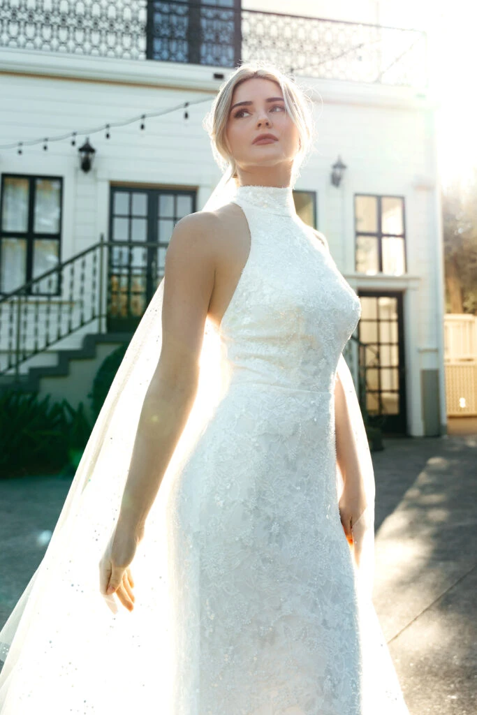 Bride wearing a halter neck beaded ad sequin wedding dress 