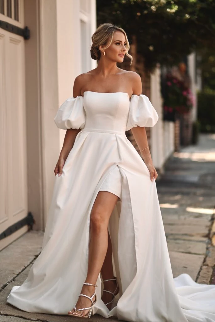 Bride wearing ballgown wedding dress with puff sleeves