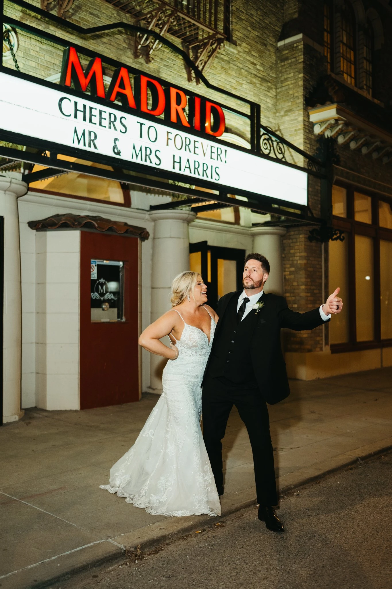Bride and groom outside a movie theater