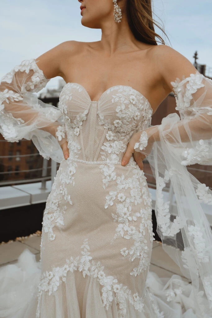 Close up of bride wearing a off the shoulder mermaid wedding dress