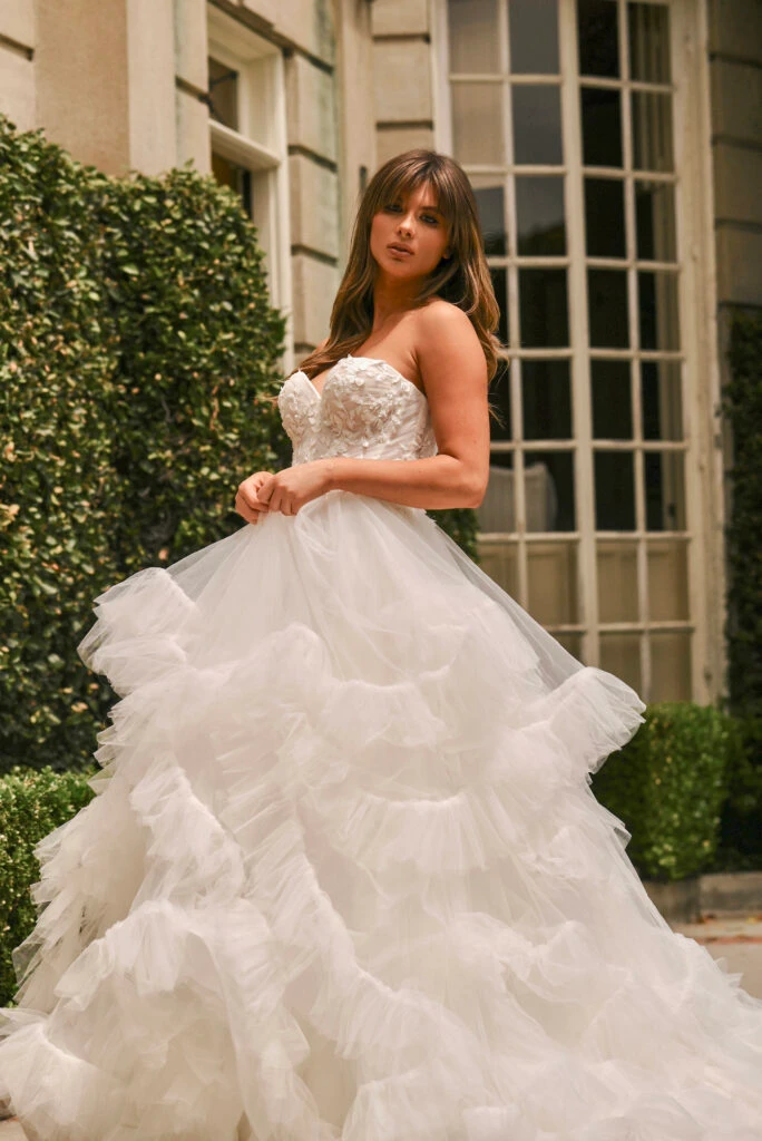 bride wearing ballgown wedding dress with ruffles tulle skirt - 1690 by Martina Liana