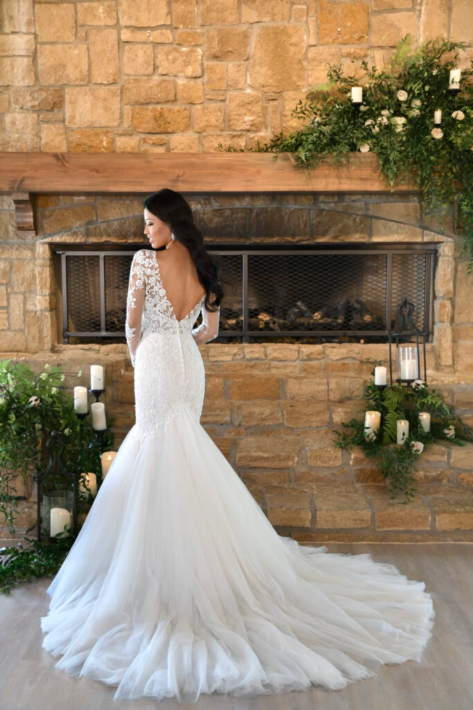 Back of bride wearing a long sleeve mermaid wedding dress