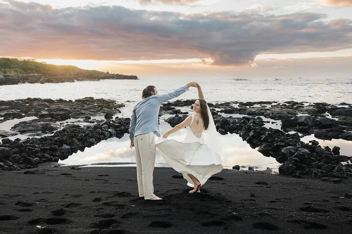 true bride emma and brandon dancing on black sand beach in hawaii - D3823 by Essense of Australia